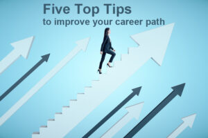 Businesswoman in suit climbs the stairs in the form of arrow